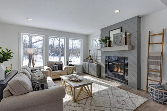 Modern Farmhouse Living Room with Shiplap Fireplace by CJC Interiors