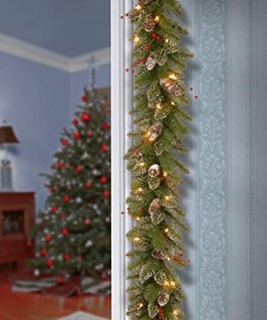 National Tree Company Pre Lit Artificial Christmas Garland Flocked With Mixed Decorations And White Lights Glittery Mountain Spruce 9 Ft 0 300x360